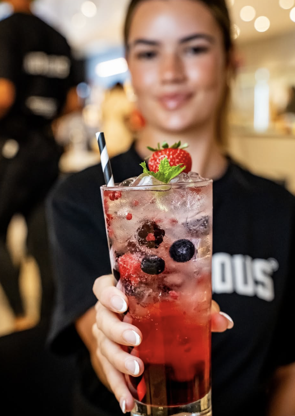 Berry mocktail in hand